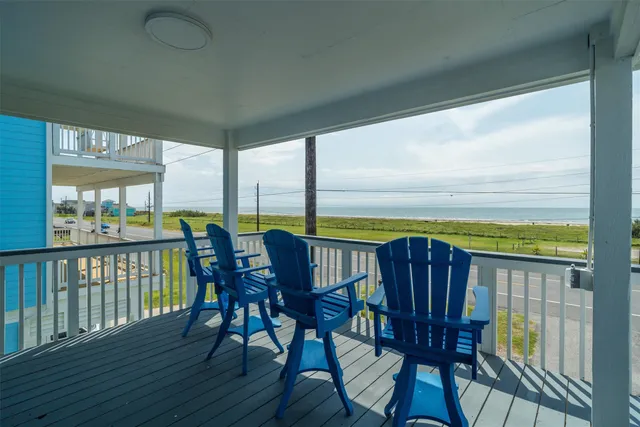 a view of a deck with table and chairs and wooden floor