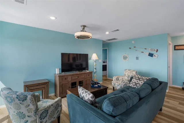 a kitchen with a center island appliances and cabinets