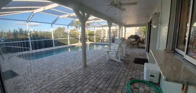 a view of a living room and a floor to ceiling window