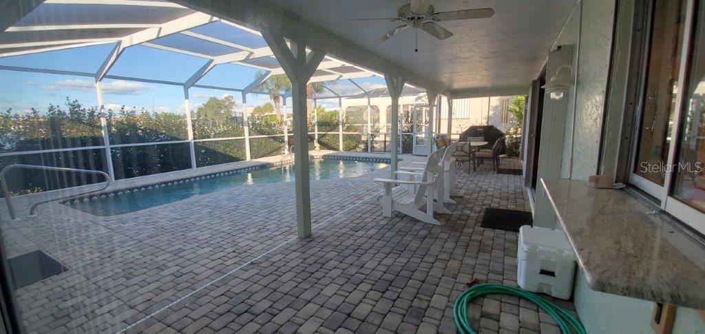 2122 Cassino Court Punta Gorda, FL 33950 - Photo 11 of 25 a view of a living room and a floor to ceiling window