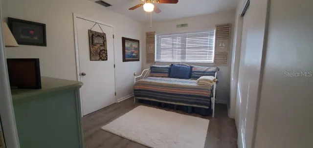 a bedroom with furniture and a window