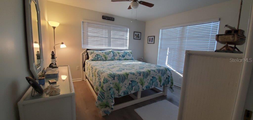 2122 Cassino Court Punta Gorda, FL 33950 - Photo 13 of 25 a bedroom with a bed and a chandelier