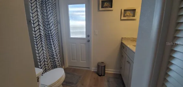 a bathroom with a sink and toilet