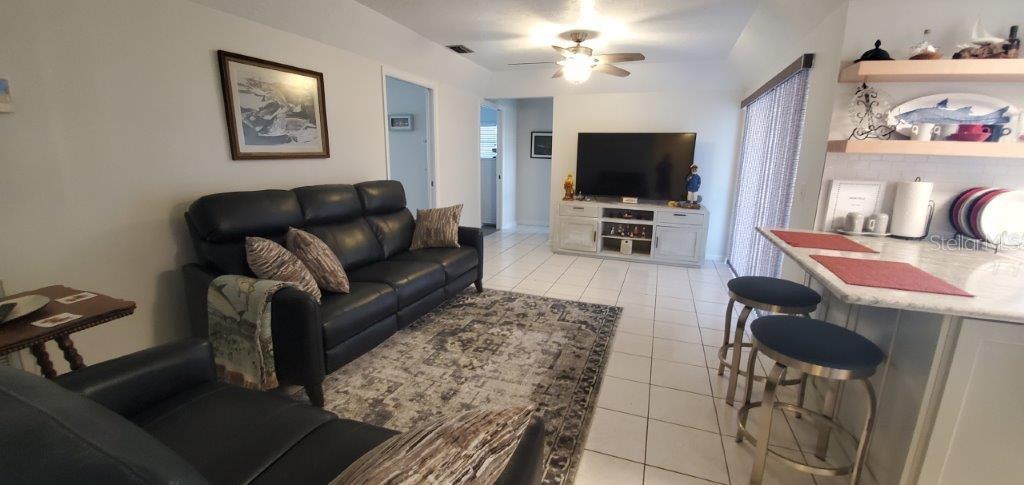2122 Cassino Court Punta Gorda, FL 33950 - Photo 17 of 25 a living room with furniture and a flat screen tv