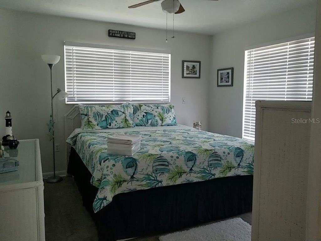 2122 Cassino Court Punta Gorda, FL 33950 - Photo 18 of 25 a bedroom with a bed dresser and a window