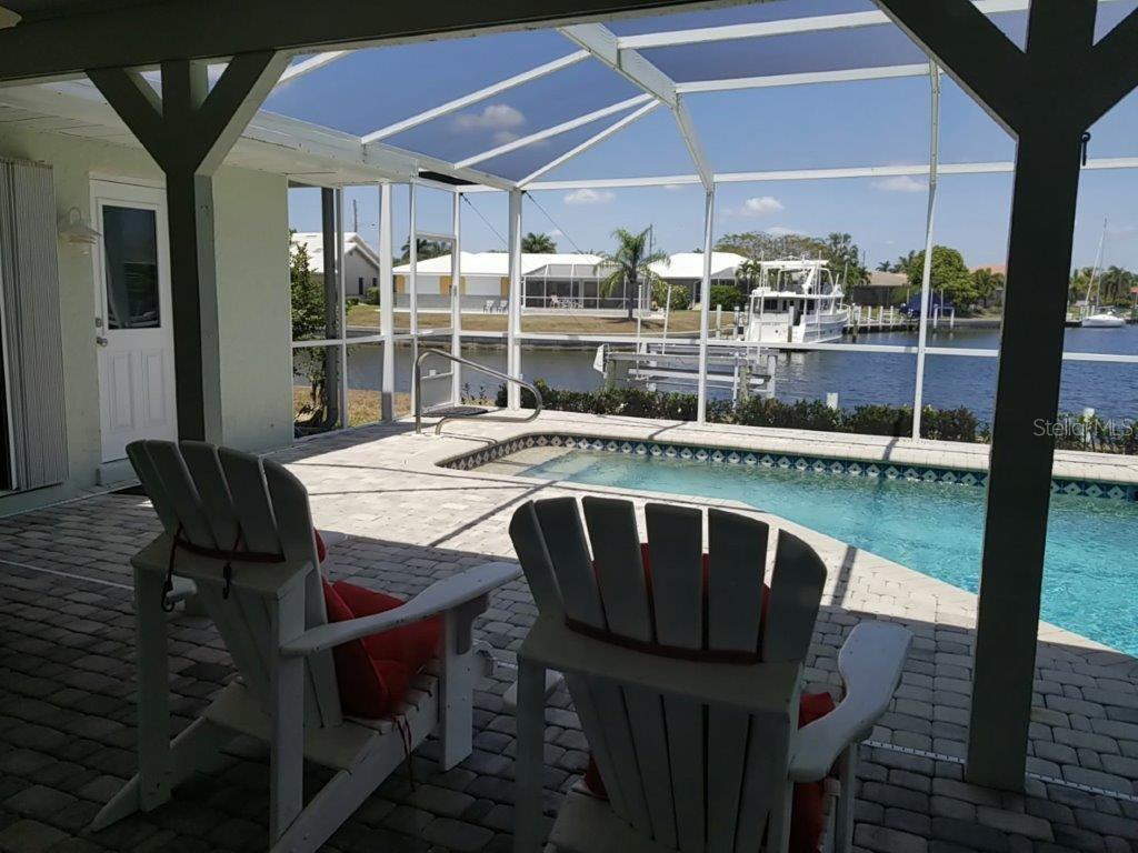 2122 Cassino Court Punta Gorda, FL 33950 - Photo 20 of 25 a view of balcony with a dining table and chairs
