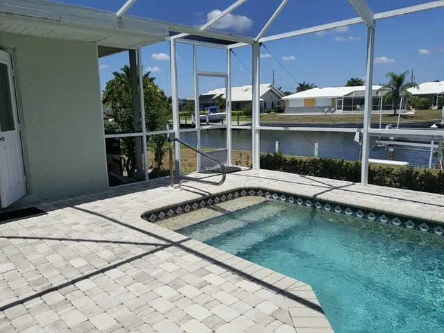 a view of a swimming pool with a patio