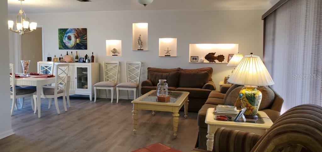 2122 Cassino Court Punta Gorda, FL 33950 - Photo 4 of 25 a living room with furniture and wooden floor