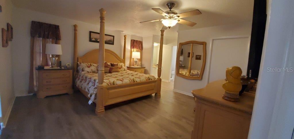 2122 Cassino Court Punta Gorda, FL 33950 - Photo 7 of 25 a bedroom with bed and wooden floor