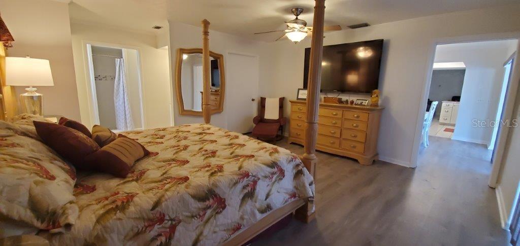2122 Cassino Court Punta Gorda, FL 33950 - Photo 10 of 25 a spacious bedroom with a bed and flat screen tv