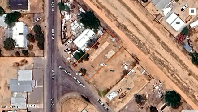 an aerial view of a residential apartment building with a yard