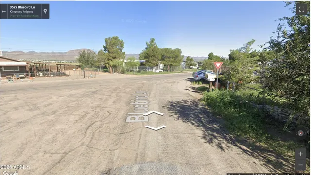 a view of a street with a houses