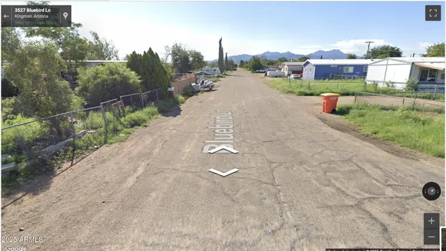 a view of a city street with a house