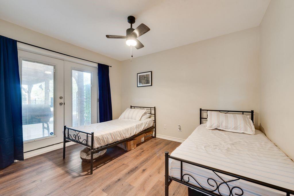 83 Crown Road Willow Park, TX 76087 - Photo 20 of 35 Wood-finish flooring, ceiling fan with integrated lighting, and white walls