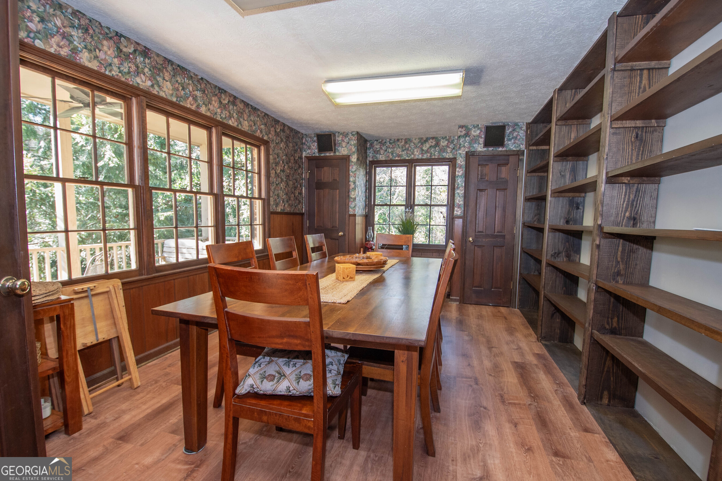 151 Evans Road Milner, GA 30257 - Photo 11 of 53 a view of a dining room with furniture window and wooden floor