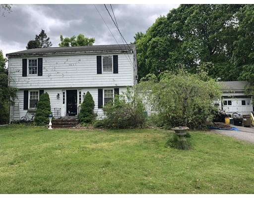 810 Main Street Hanover, MA 02339 - Photo 2 of 2 a front view of a house with a yard