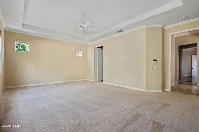 a spacious bathroom with a tub sink and mirror