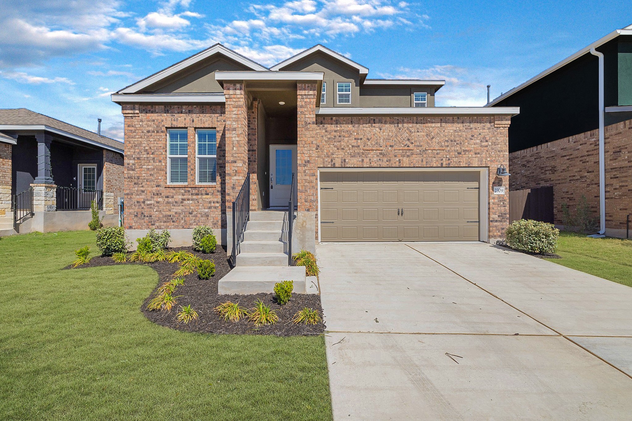 2309 Four Waters Loop Georgetown, TX 78628 - Photo 1 of 1 View of front of house with concrete driveway, an attached garage, and a front yard