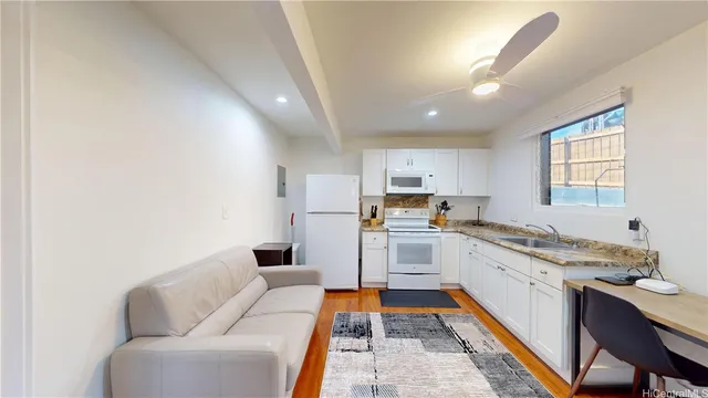 a kitchen with stainless steel appliances granite countertop a sink and cabinets