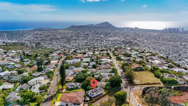 an aerial view of residential houses with outdoor space