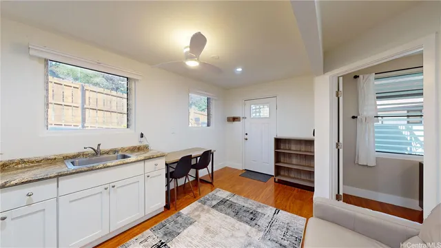 a spacious bathroom with double vanity and a mirror