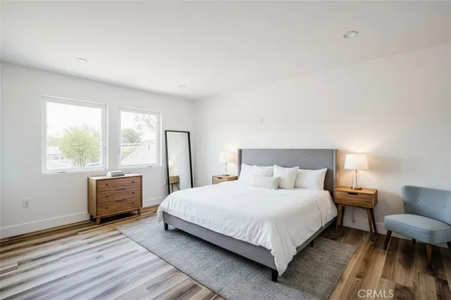 a bedroom with a bed and a couch