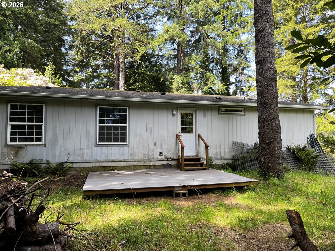 83411 Clear Lake Road Florence, OR 97439 - Photo 40 of 47 a view of a backyard with a small pool