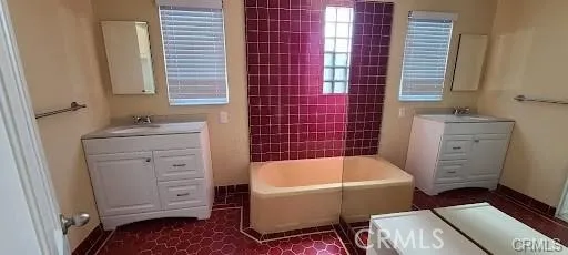 a bathroom with a sink toilet and bathtub