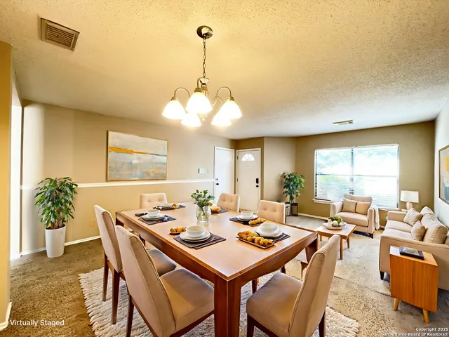 a view of a dining room with furniture window and outside view