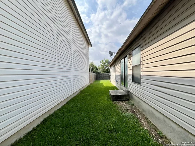 a view of a backyard with plants