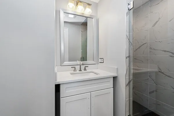 a bathroom with a sink and a mirror