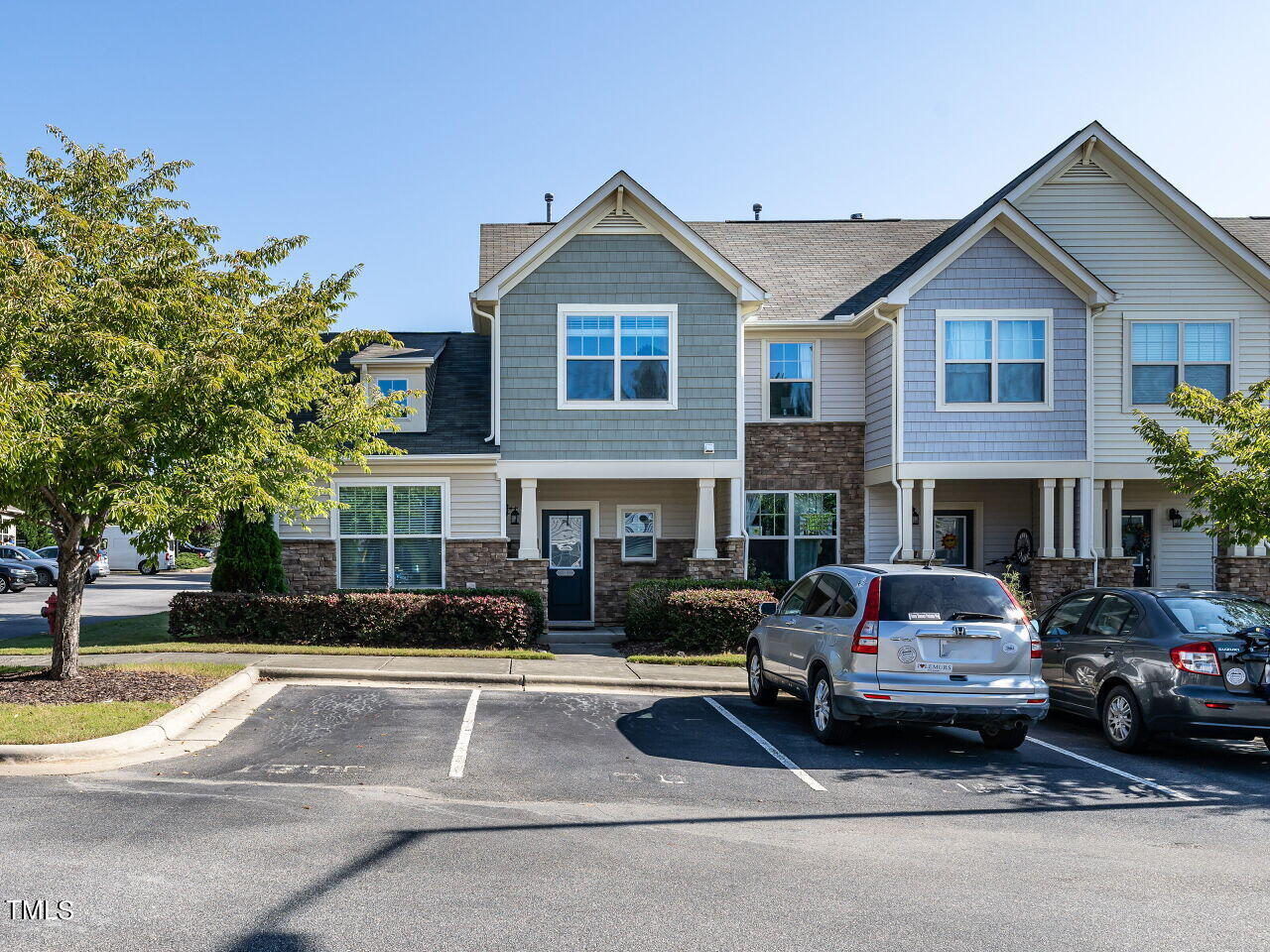 a car parked in front of a house