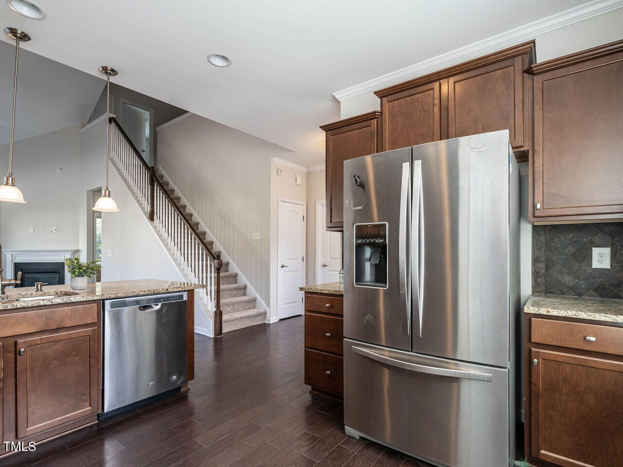 11 St Elias Drive Durham, NC 27705 - Photo 12 of 34 a kitchen with stainless steel appliances a refrigerator and a stove top oven