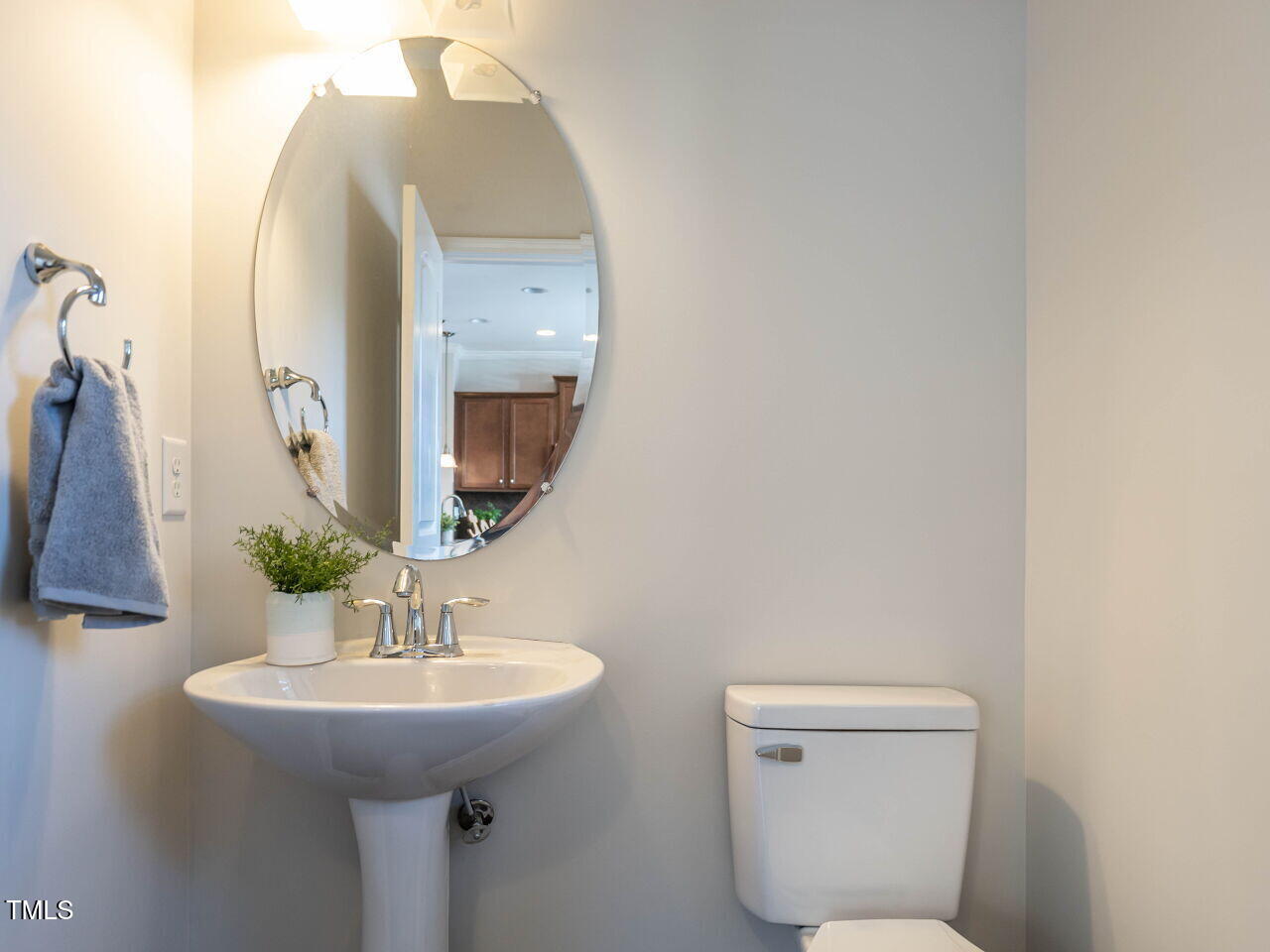 11 St Elias Drive Durham, NC 27705 - Photo 13 of 34 a bathroom with a toilet sink and mirror