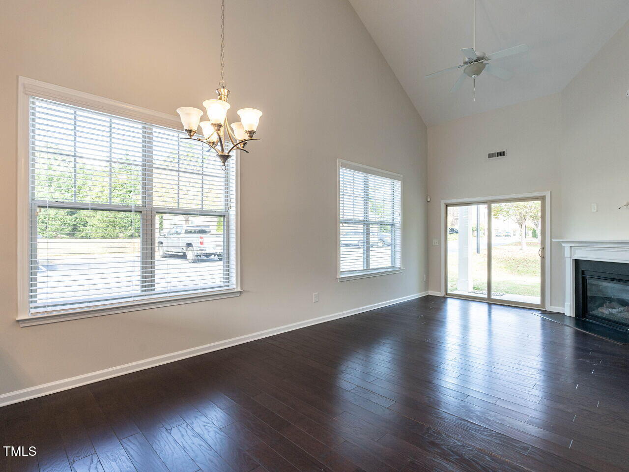 11 St Elias Drive Durham, NC 27705 - Photo 14 of 34 a view of an empty room with wooden floor and a window