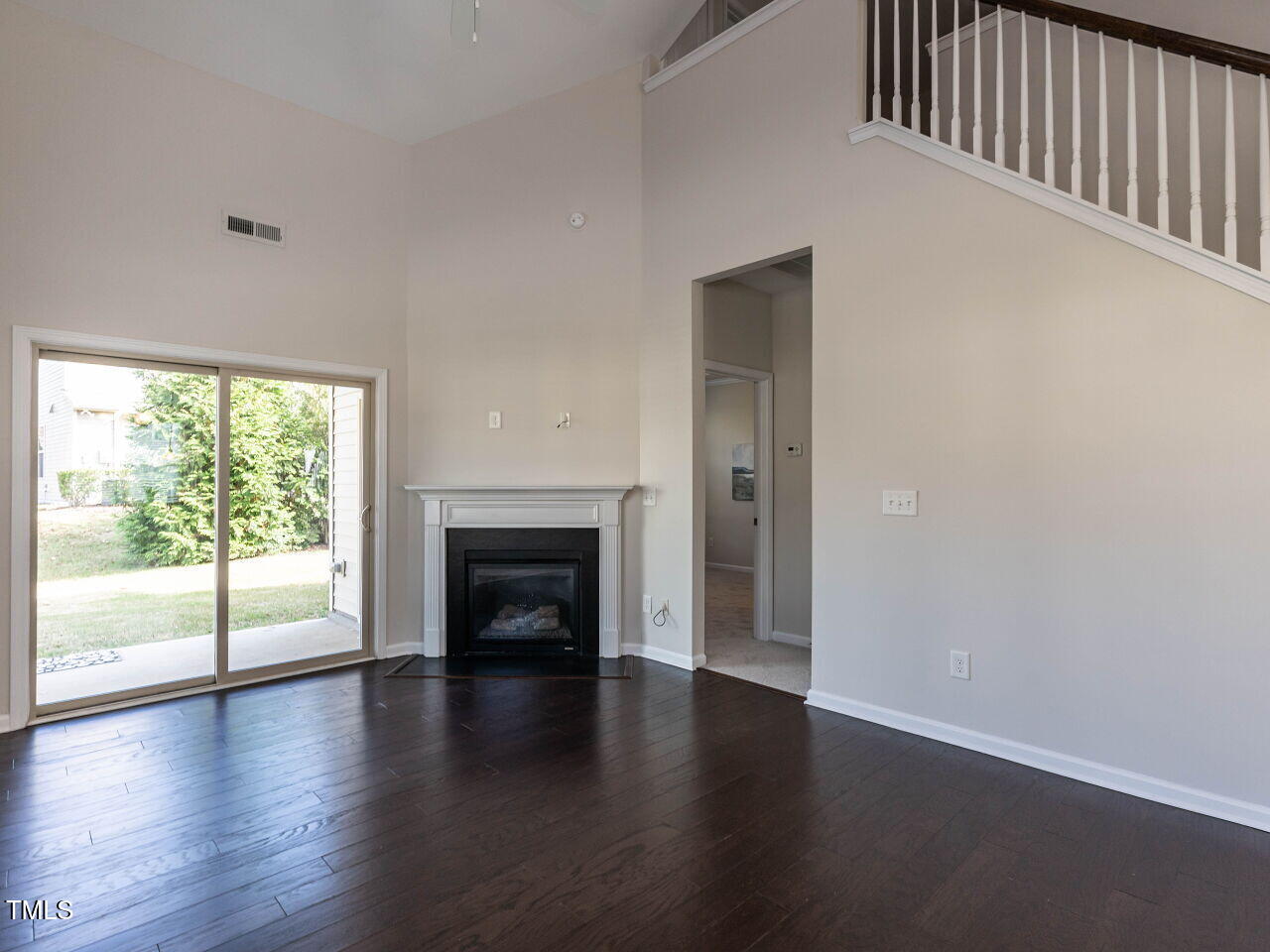 11 St Elias Drive Durham, NC 27705 - Photo 16 of 34 a view of an empty room with wooden floor and a window