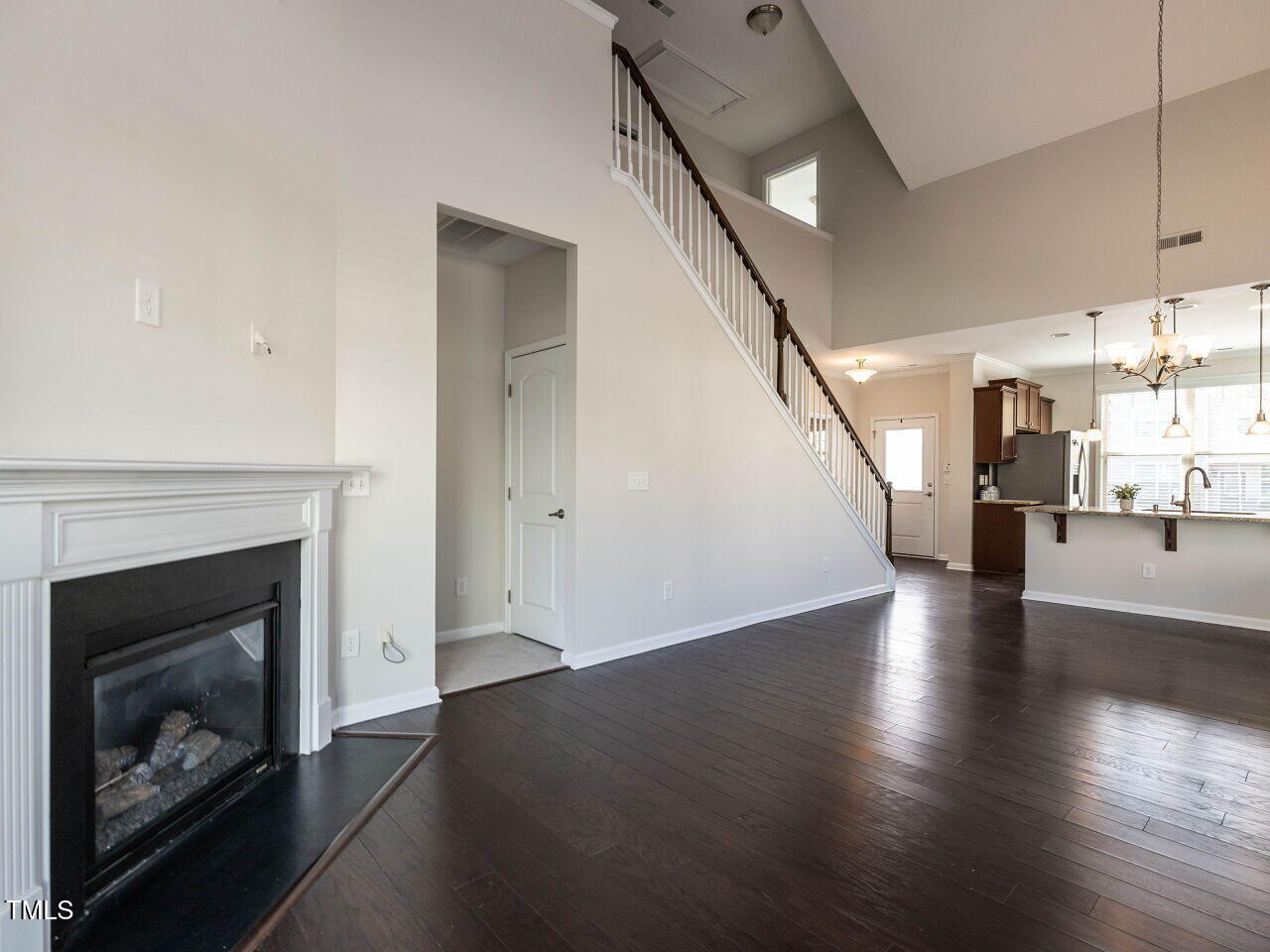 11 St Elias Drive Durham, NC 27705 - Photo 19 of 34 a view of a kitchen with furniture and a fireplace