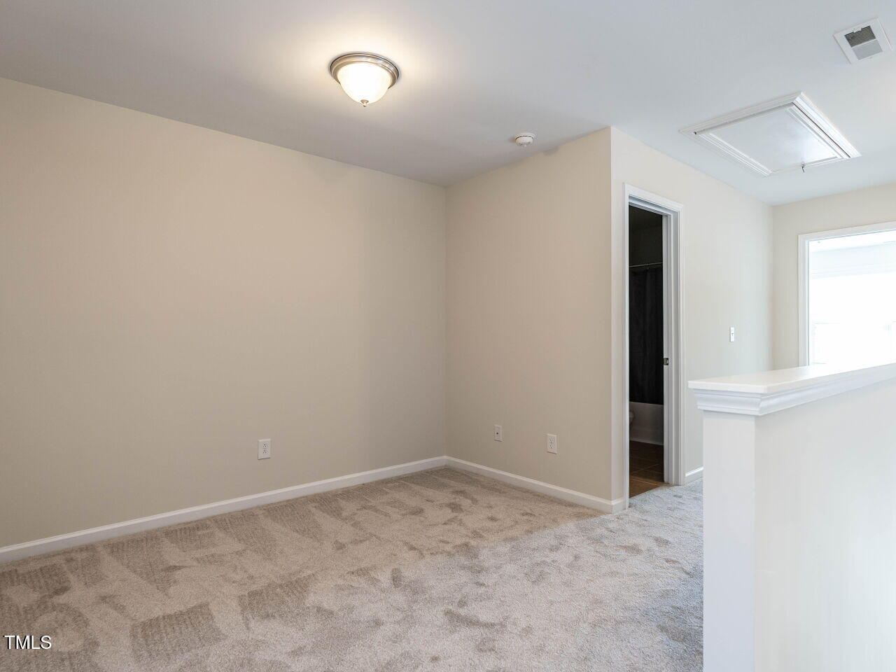 11 St Elias Drive Durham, NC 27705 - Photo 26 of 34 an empty room with a natural light