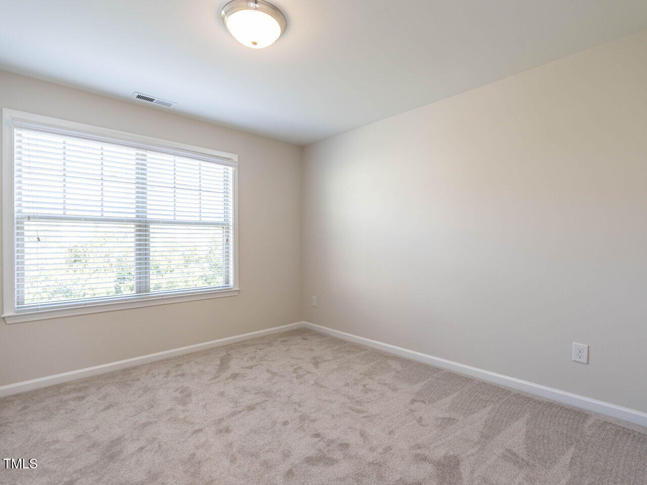 11 St Elias Drive Durham, NC 27705 - Photo 28 of 34 an empty room with a window