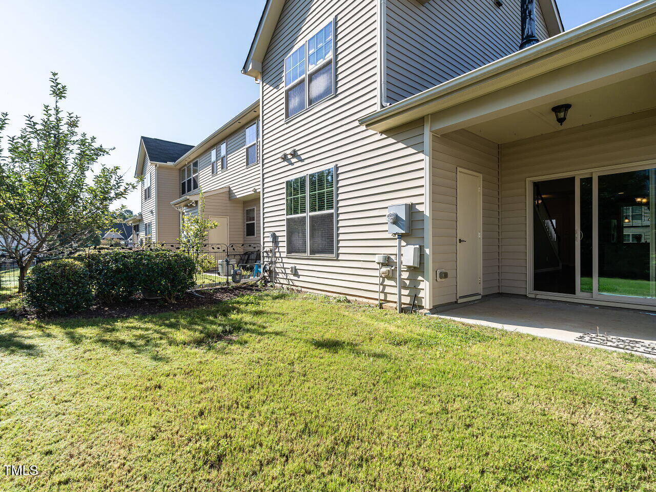 11 St Elias Drive Durham, NC 27705 - Photo 32 of 34 a view of a backyard with plants and a patio