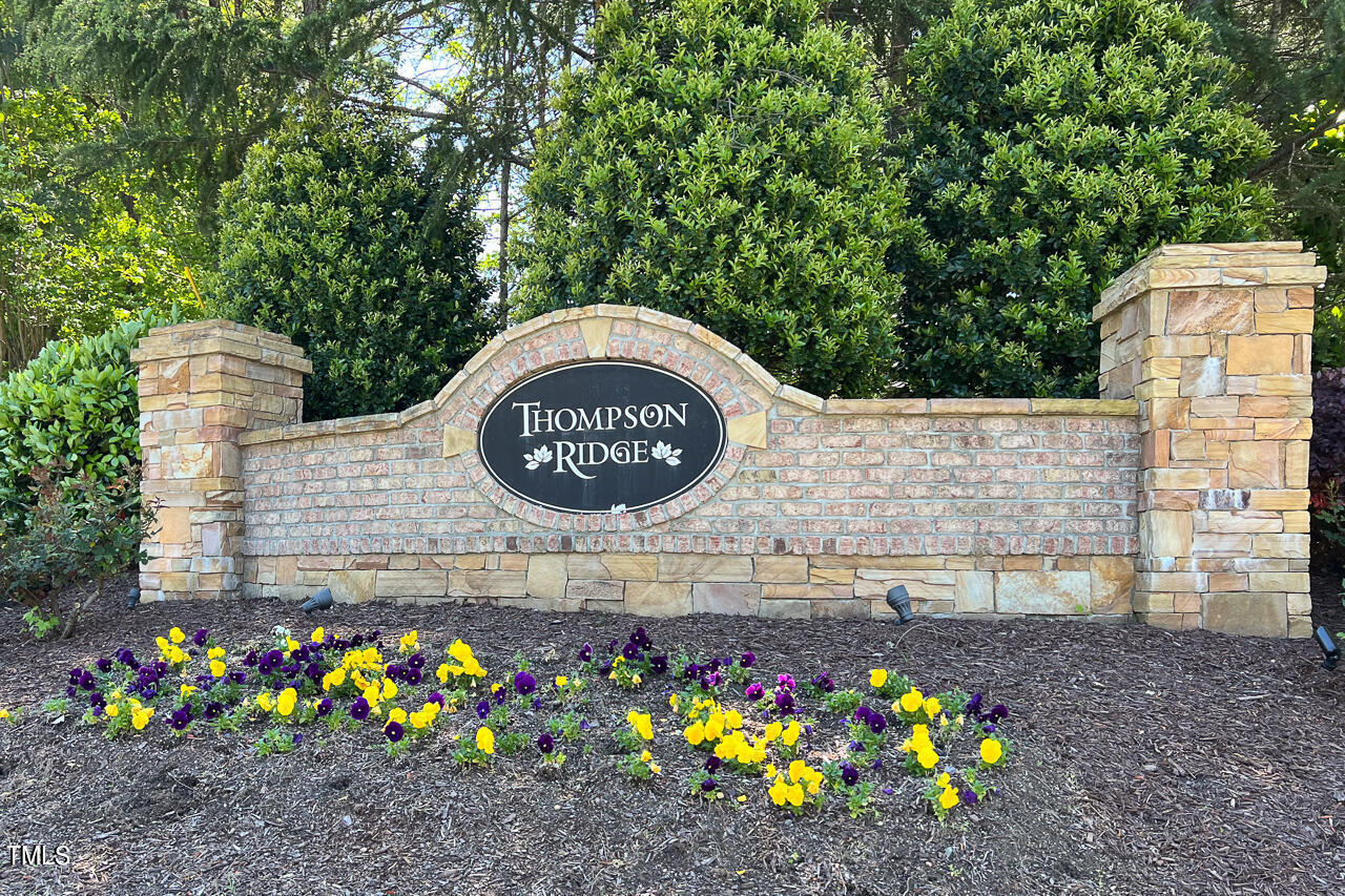 11 St Elias Drive Durham, NC 27705 - Photo 34 of 34 a sign that is sitting in front of flowers