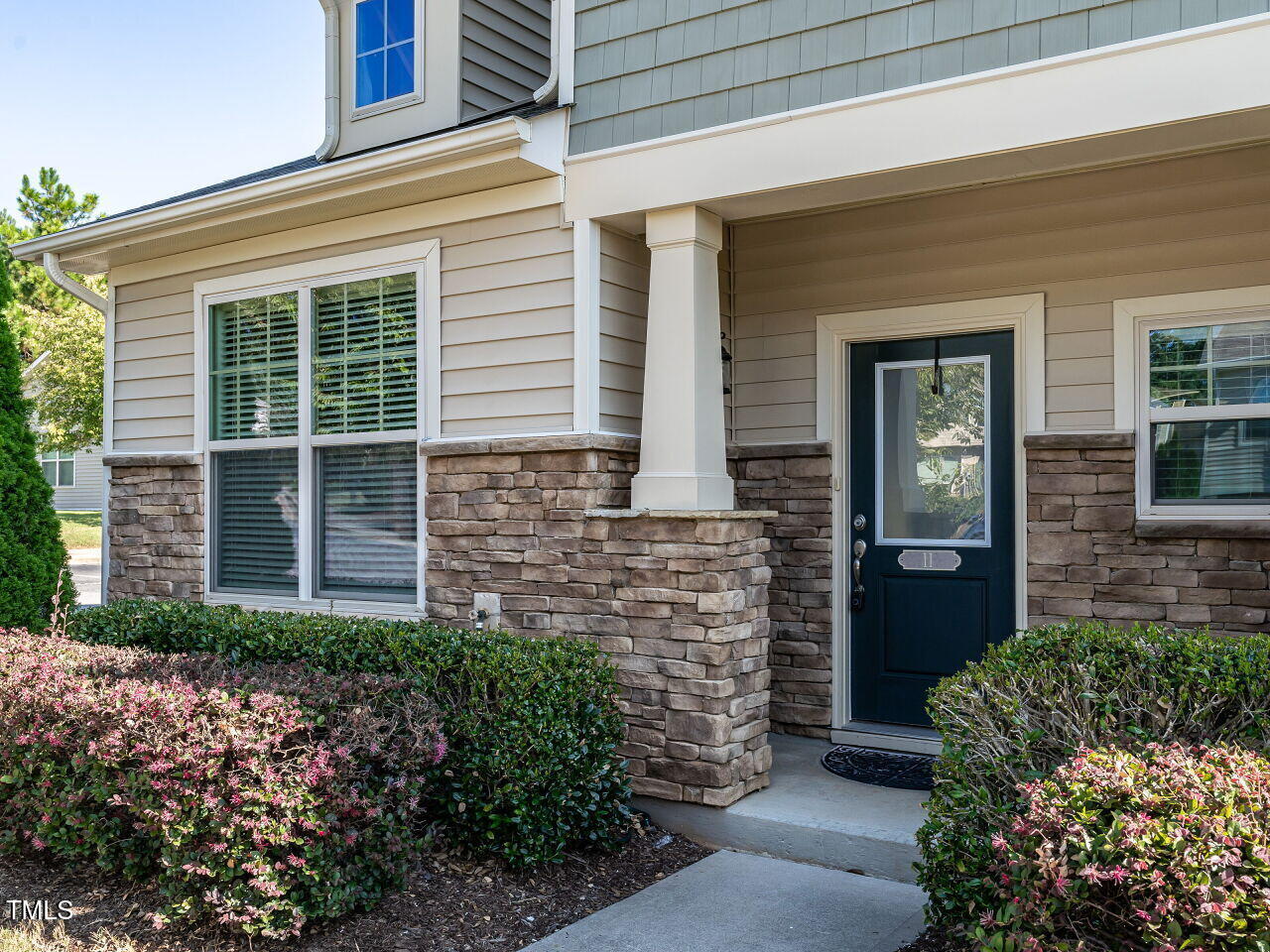 11 St Elias Drive Durham, NC 27705 - Photo 4 of 34 a front view of a house with a garden