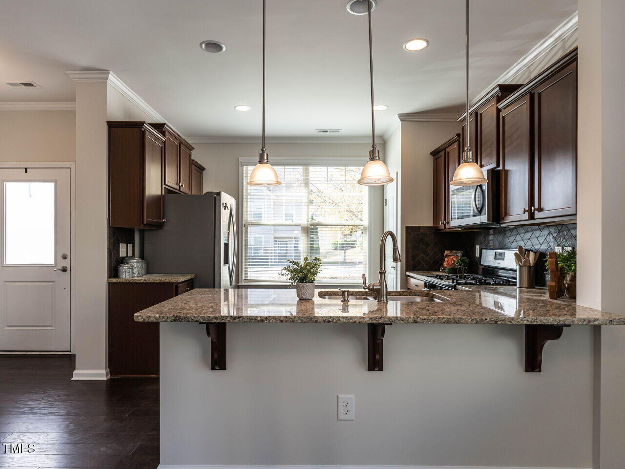 11 St Elias Drive Durham, NC 27705 - Photo 8 of 34 a kitchen with counter top space cabinets and appliances