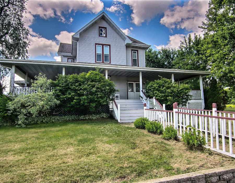 8430 West State Road Rockford, IL 61102 - Photo 1 of 25 a front view of a house with a yard