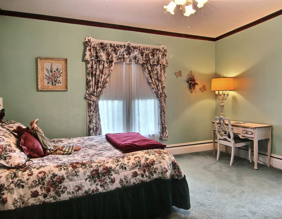 8430 West State Road Rockford, IL 61102 - Photo 12 of 25 a bedroom with a bed and a chair in it