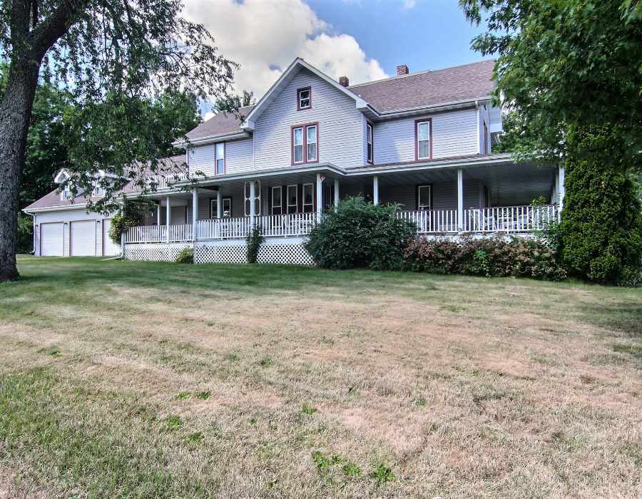 8430 West State Road Rockford, IL 61102 - Photo 2 of 25 a front view of a house with a garden