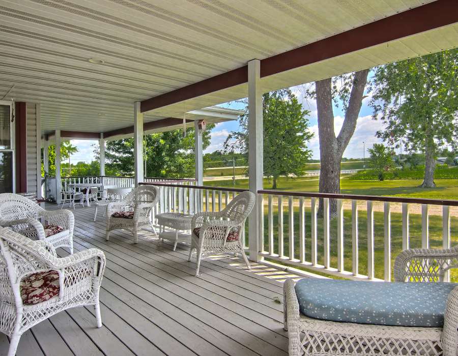 8430 West State Road Rockford, IL 61102 - Photo 22 of 25 a view of a chair and tables in the balcony
