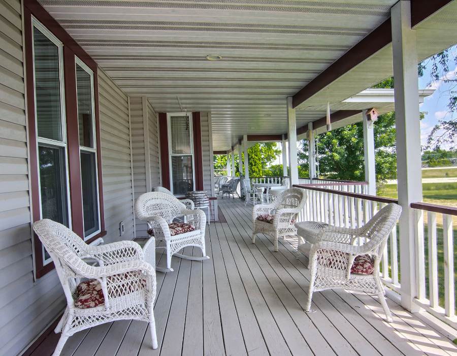 8430 West State Road Rockford, IL 61102 - Photo 23 of 25 a balcony with furniture and wooden floor