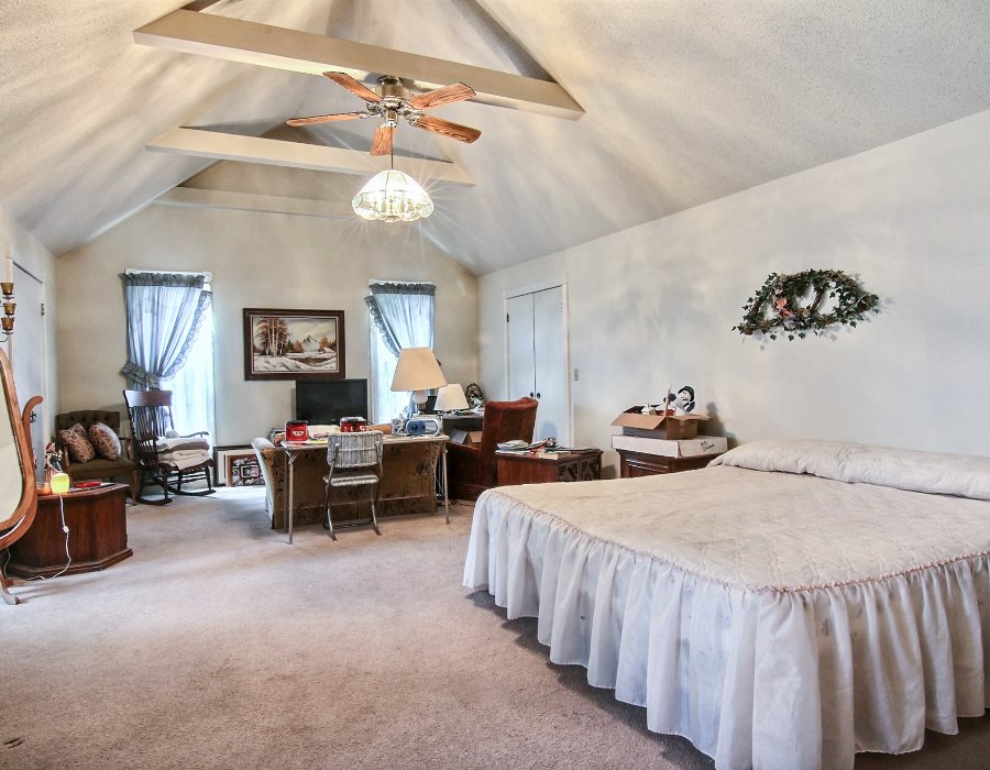 8430 West State Road Rockford, IL 61102 - Photo 9 of 25 a bedroom with two beds and painting on the wall