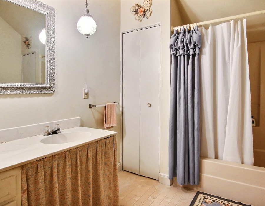 8430 West State Road Rockford, IL 61102 - Photo 10 of 25 a bathroom with a sink and a mirror